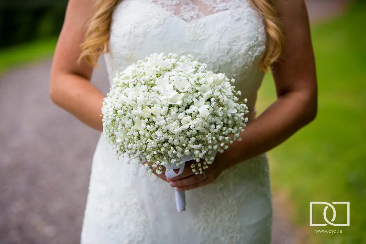 bride holding flowers at castle leslie co monaghan