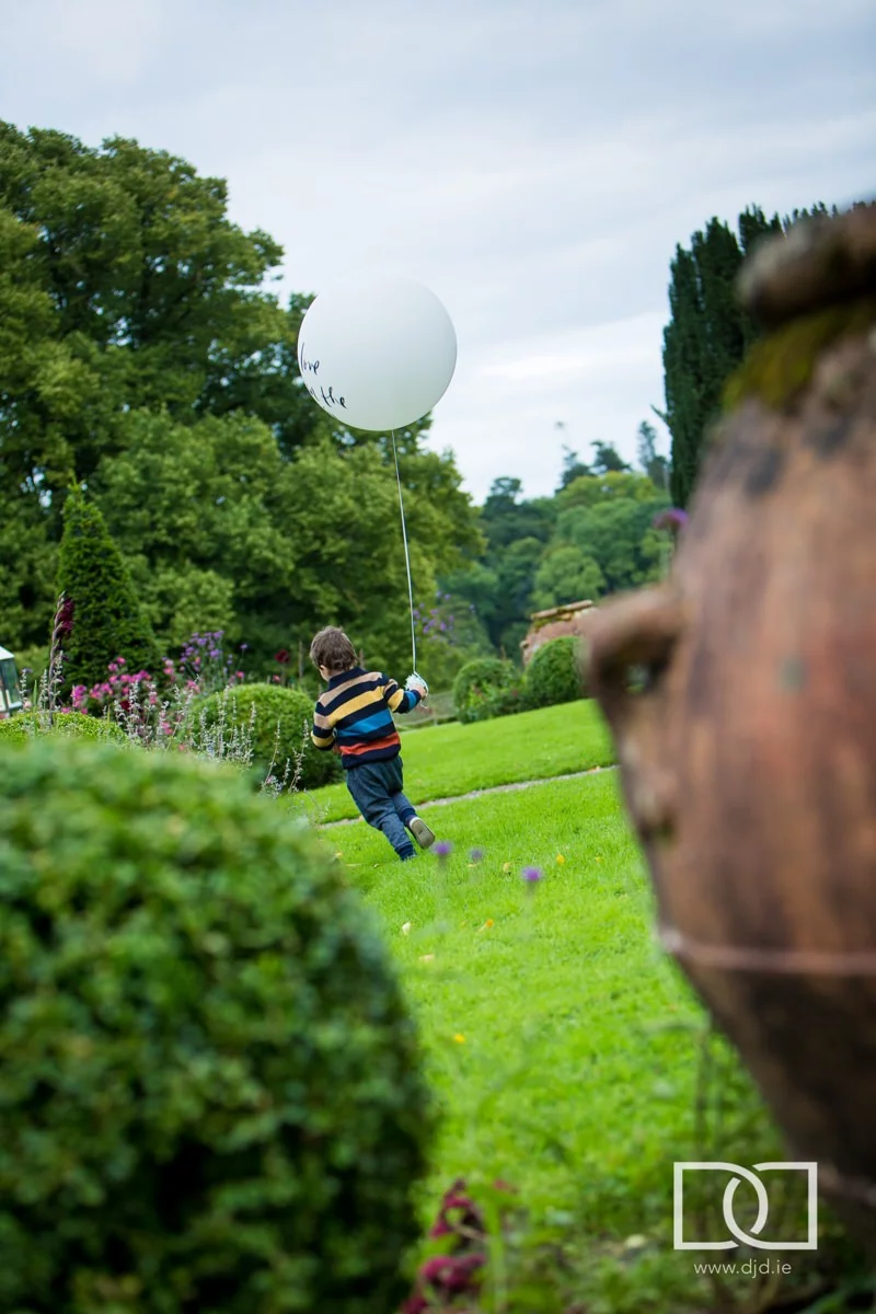 kid with balloon at a wedding at castle leslie co monaghan
