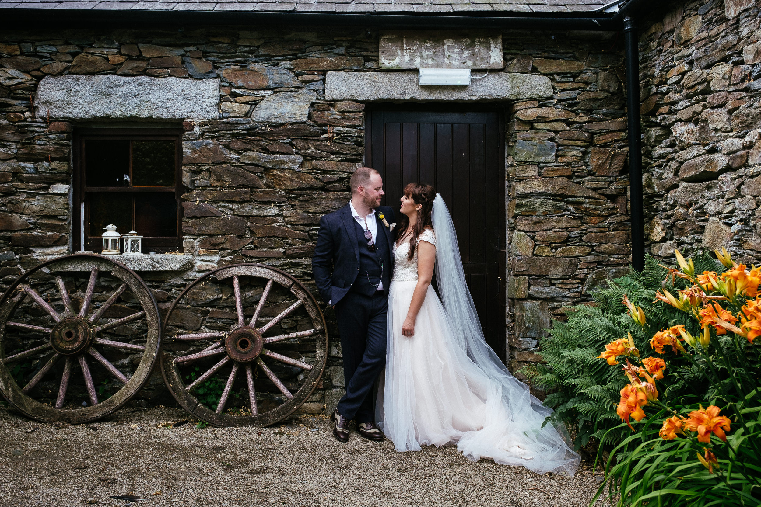 bride and groom standing by a door in ballybeg house