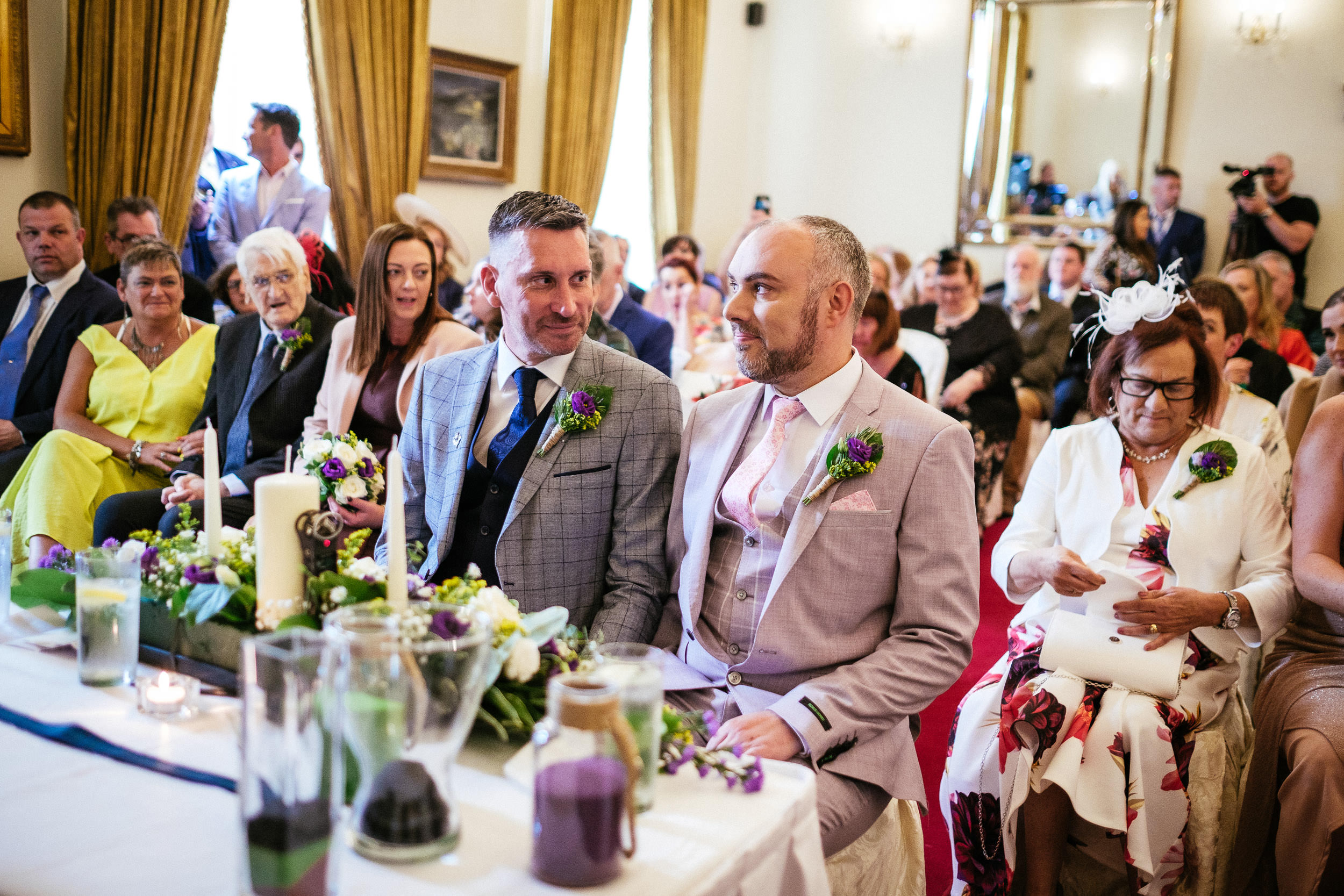 two grooms talking to each other during their wedding ceremony at dunboyne castle