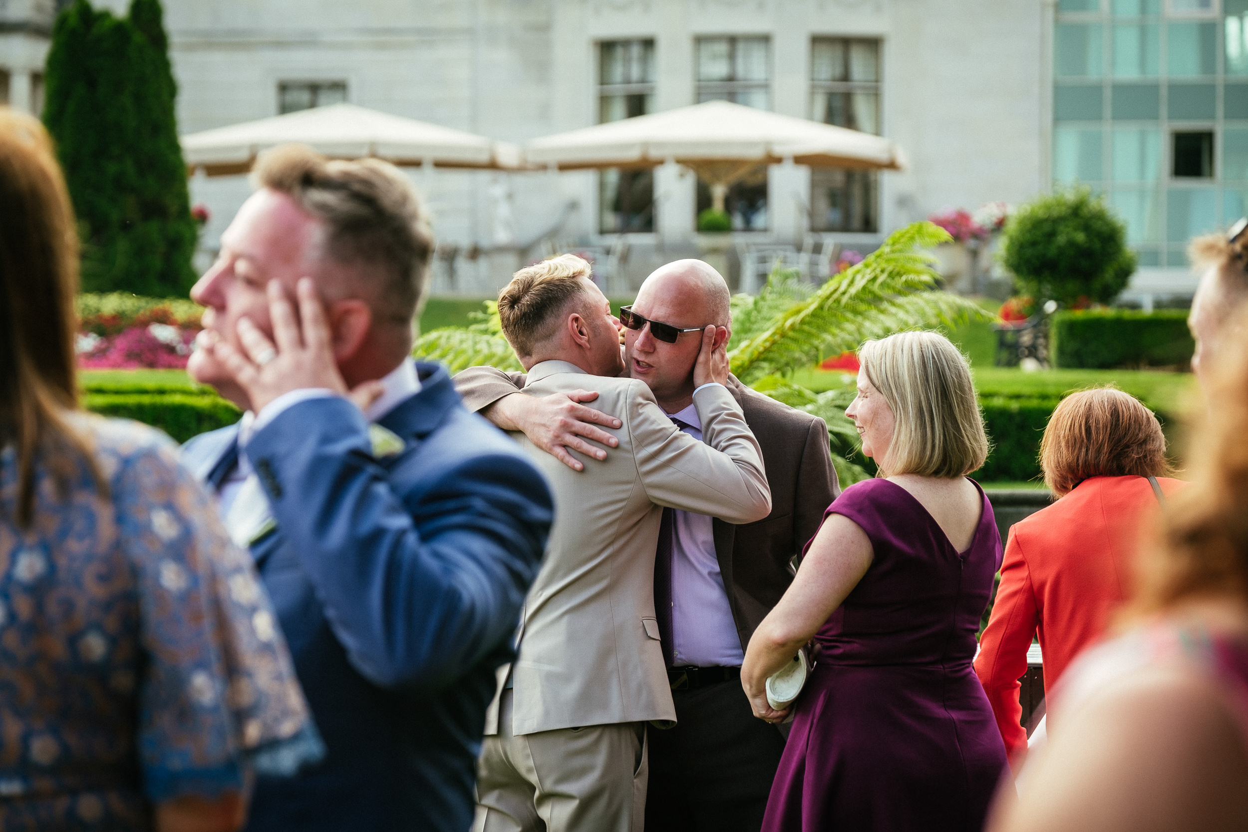 wedding guests embracing