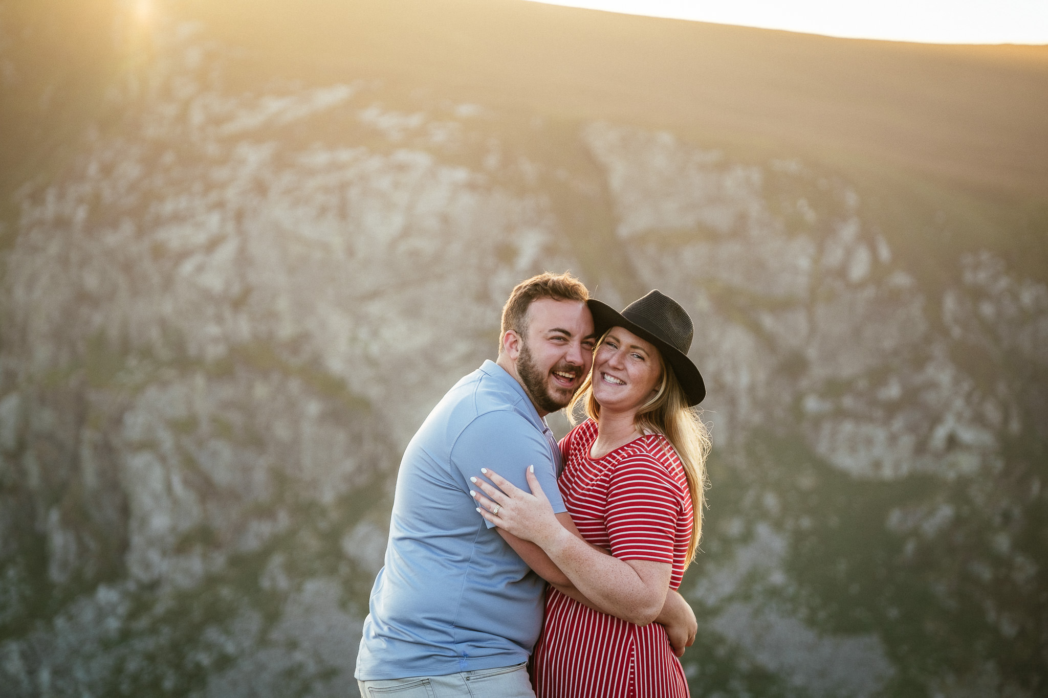 engaged couple laughing at sunset at Lough Tay Guinness Lake