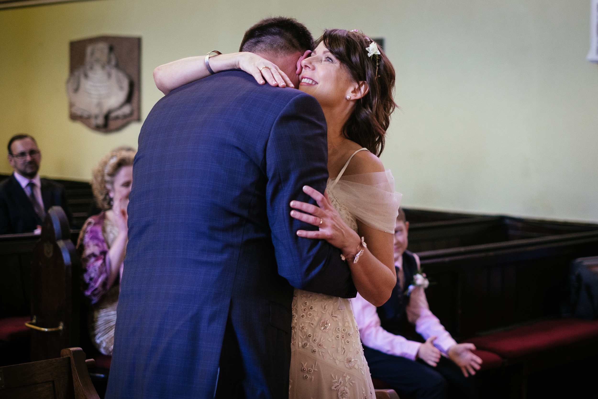 bride and groom hugging after exchanging vows at their Dublin Unitarian Church