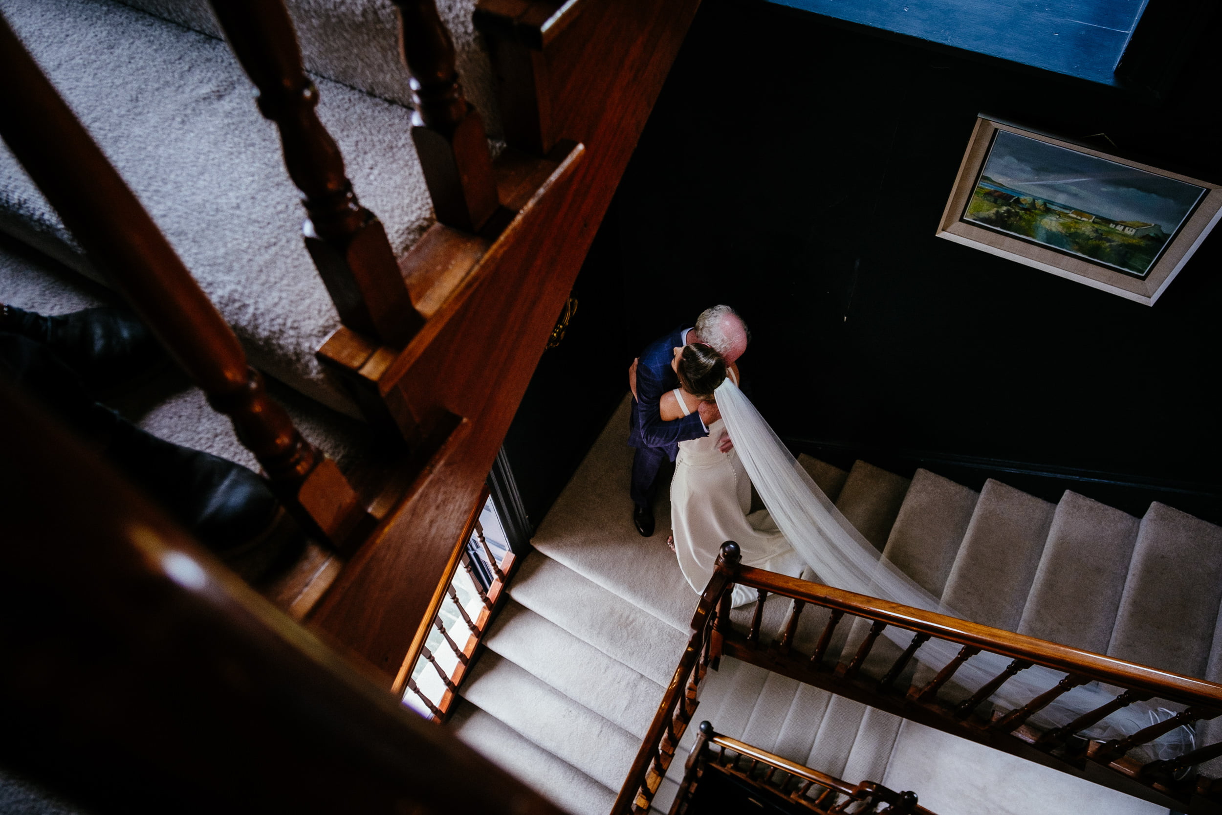 bride meeting her father on the staircase at her Boyne Hill House Wedding
