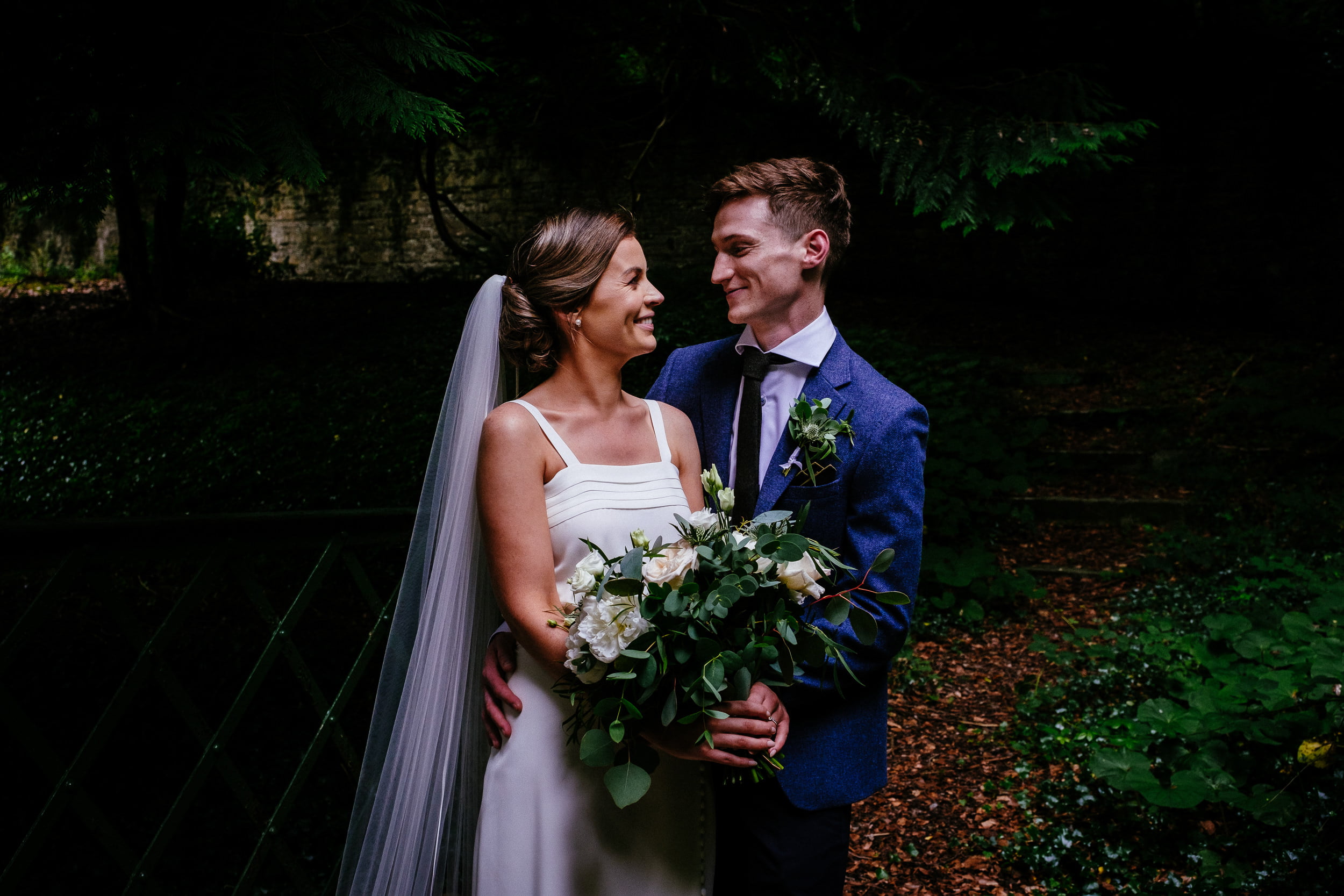 bride and groom talking in the walled garden at their Boyne Hill House Wedding