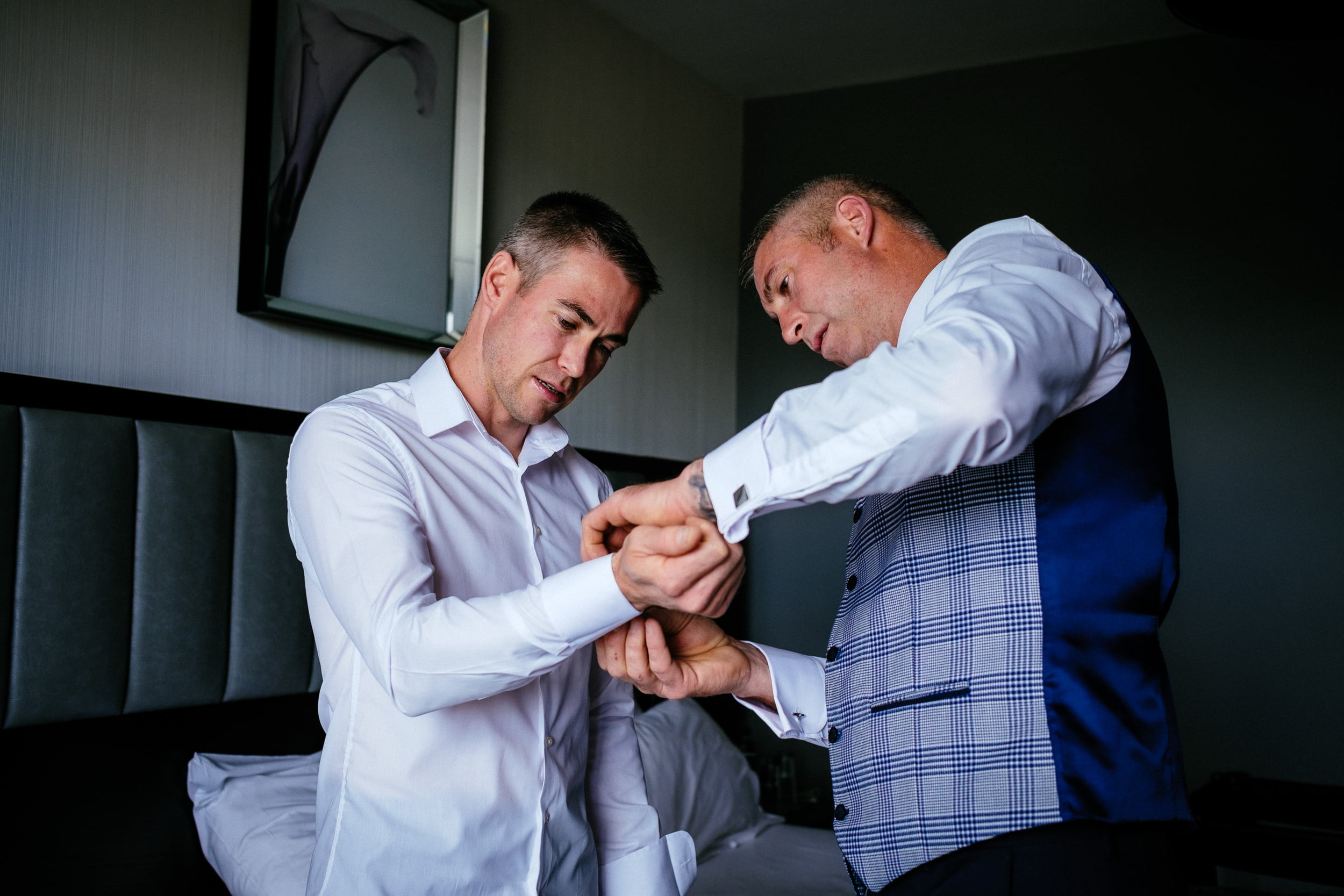 best man helping groom with cufflinks at the Fota Island Resort Cork