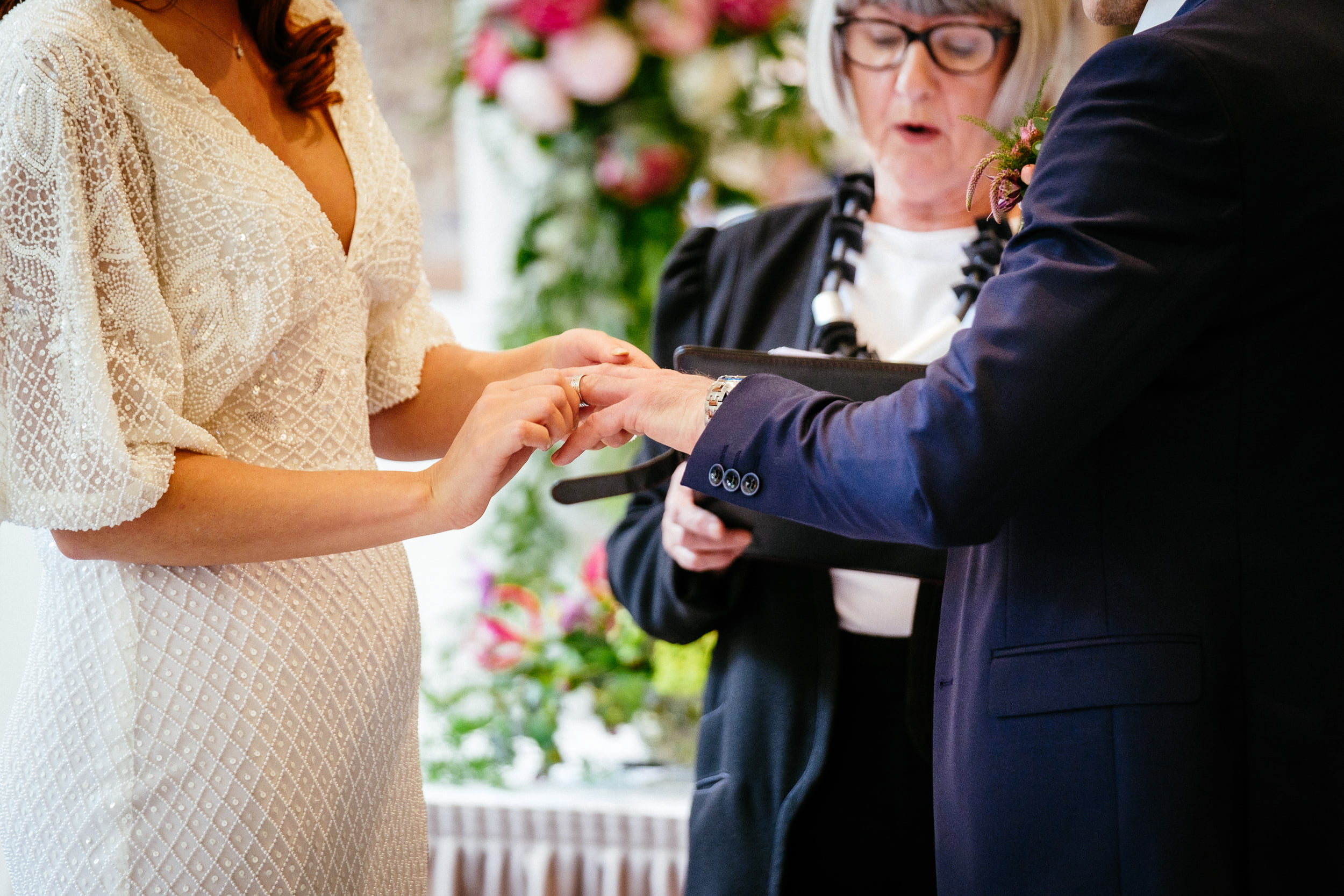 bride and groom exchanging rings at their Fota Island Resort Cork wedding