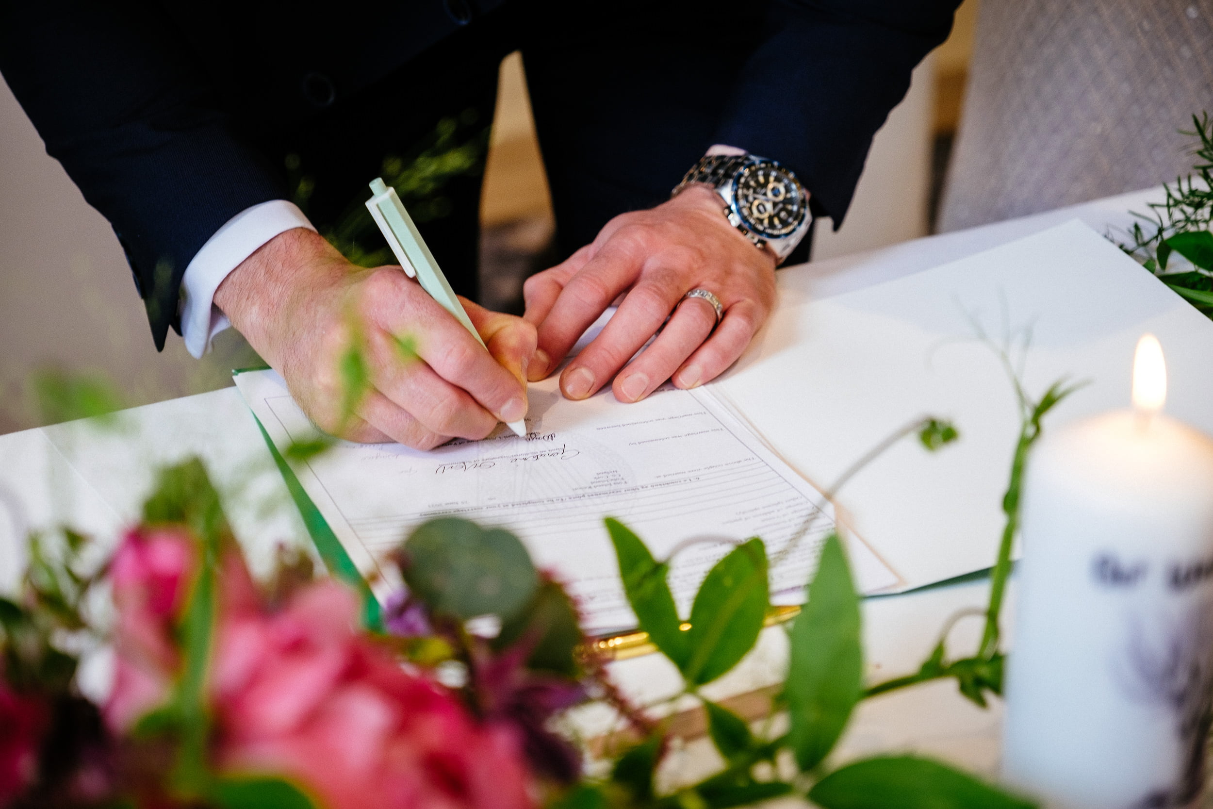 groom signing register at their Fota Island Resort Cork wedding