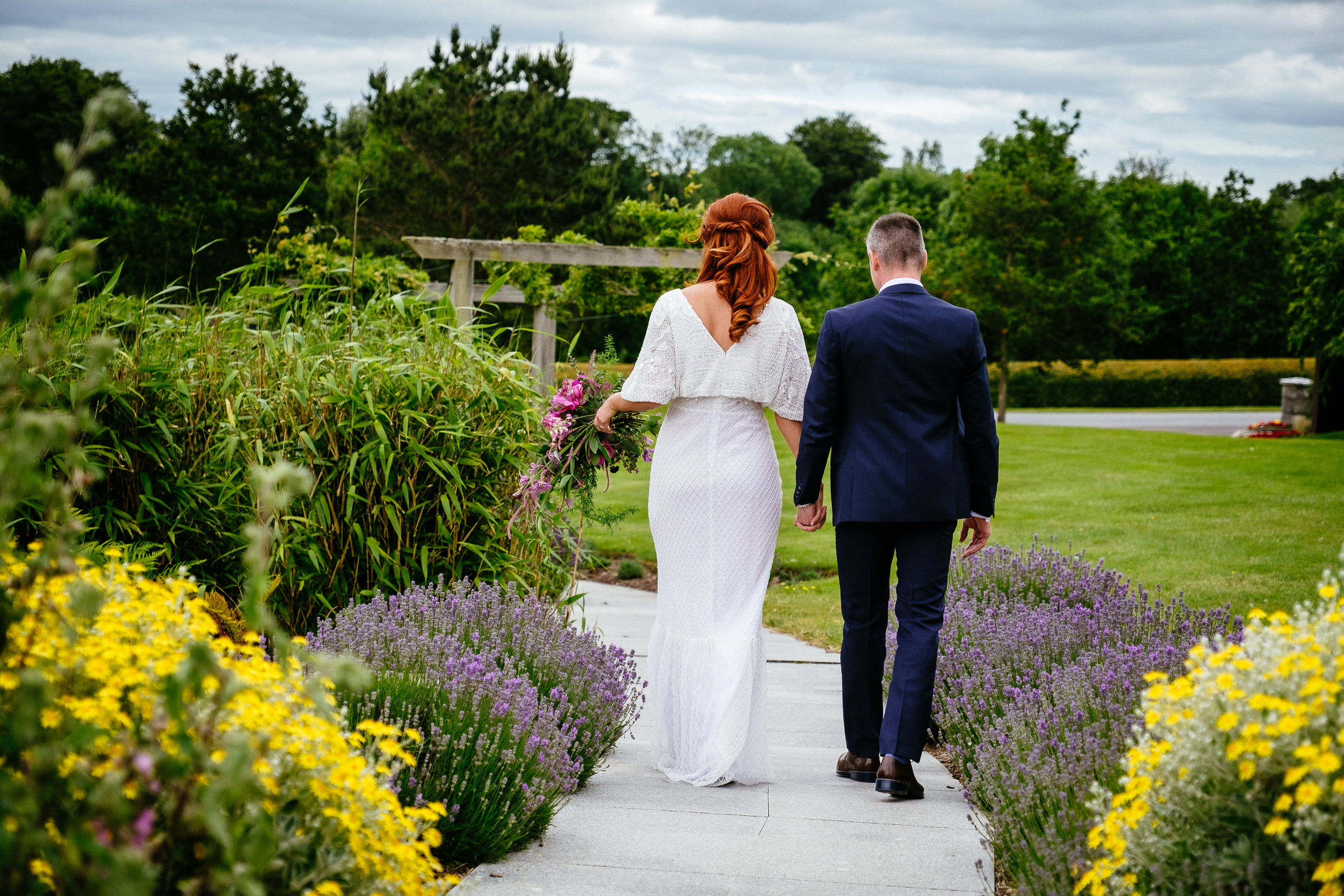 bride and groom walking at a Fota Island Resort Cork wedding