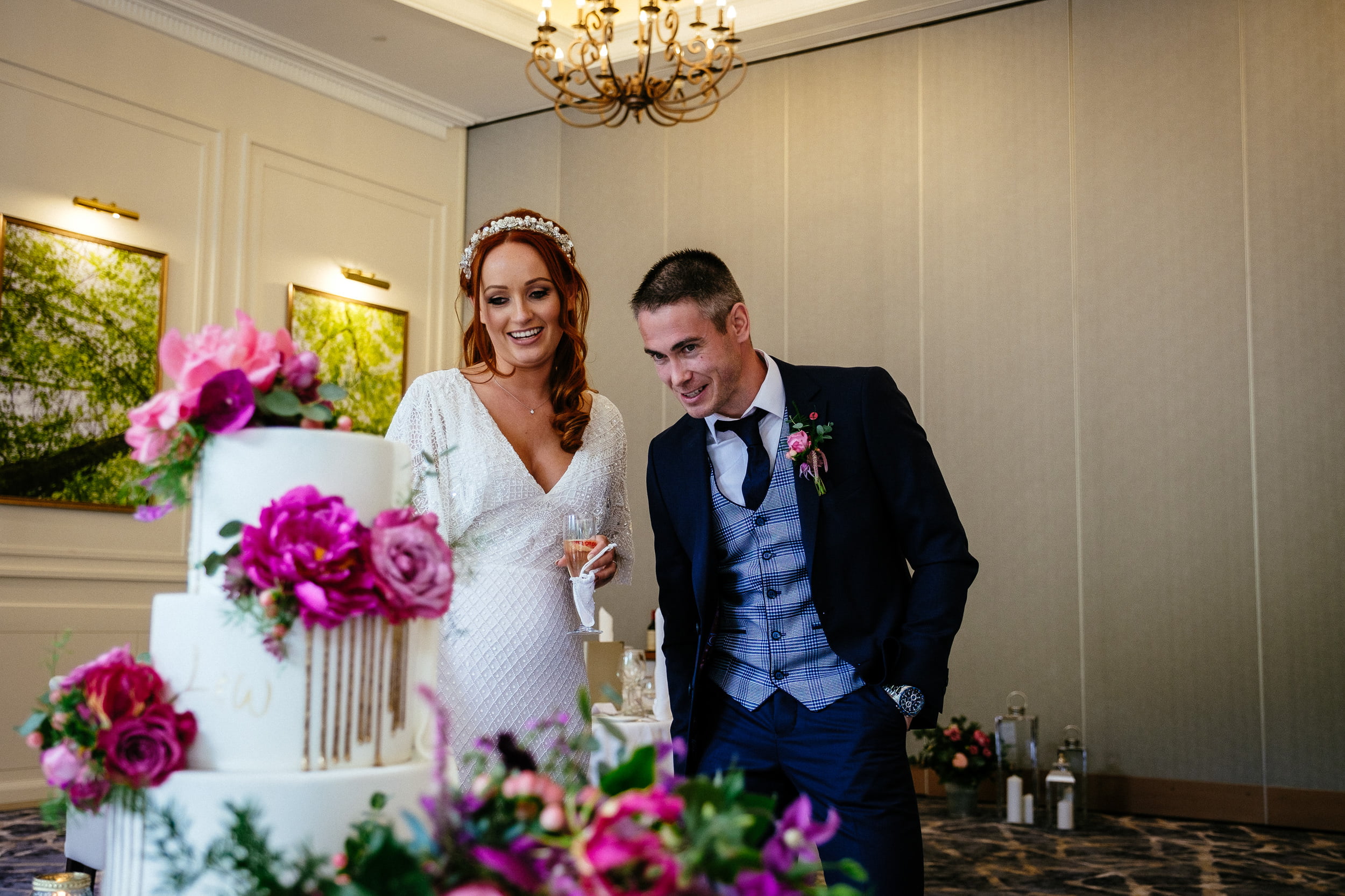 bride and groom looking at the cake at a Fota Island Resort Cork wedding