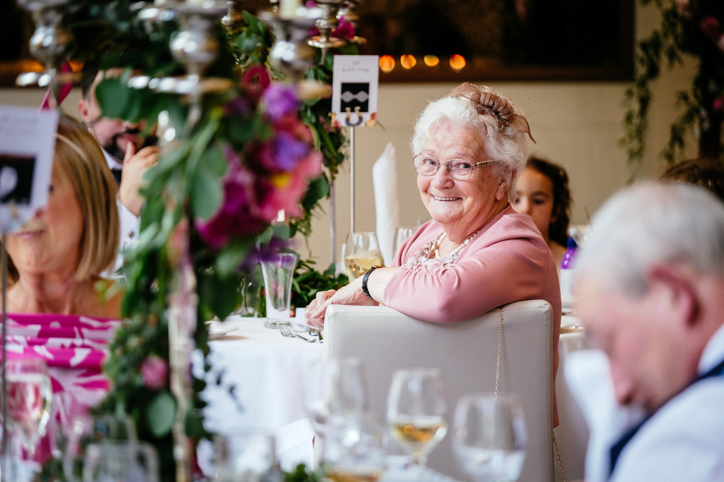 grandmother smiling during speeches at a Fota Island Resort Cork wedding